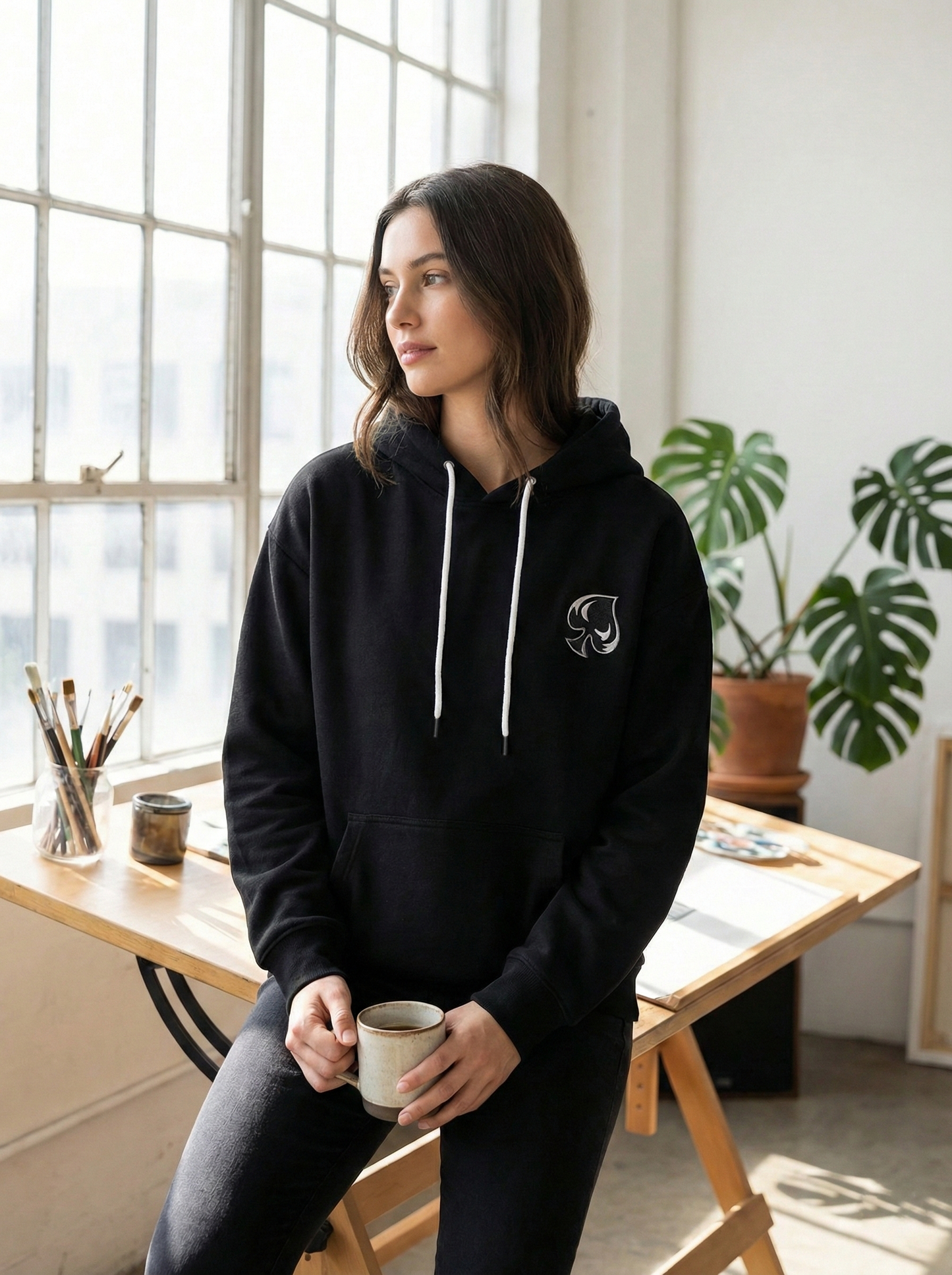 AI generated picture of a woman wearing a hoodie in s loft