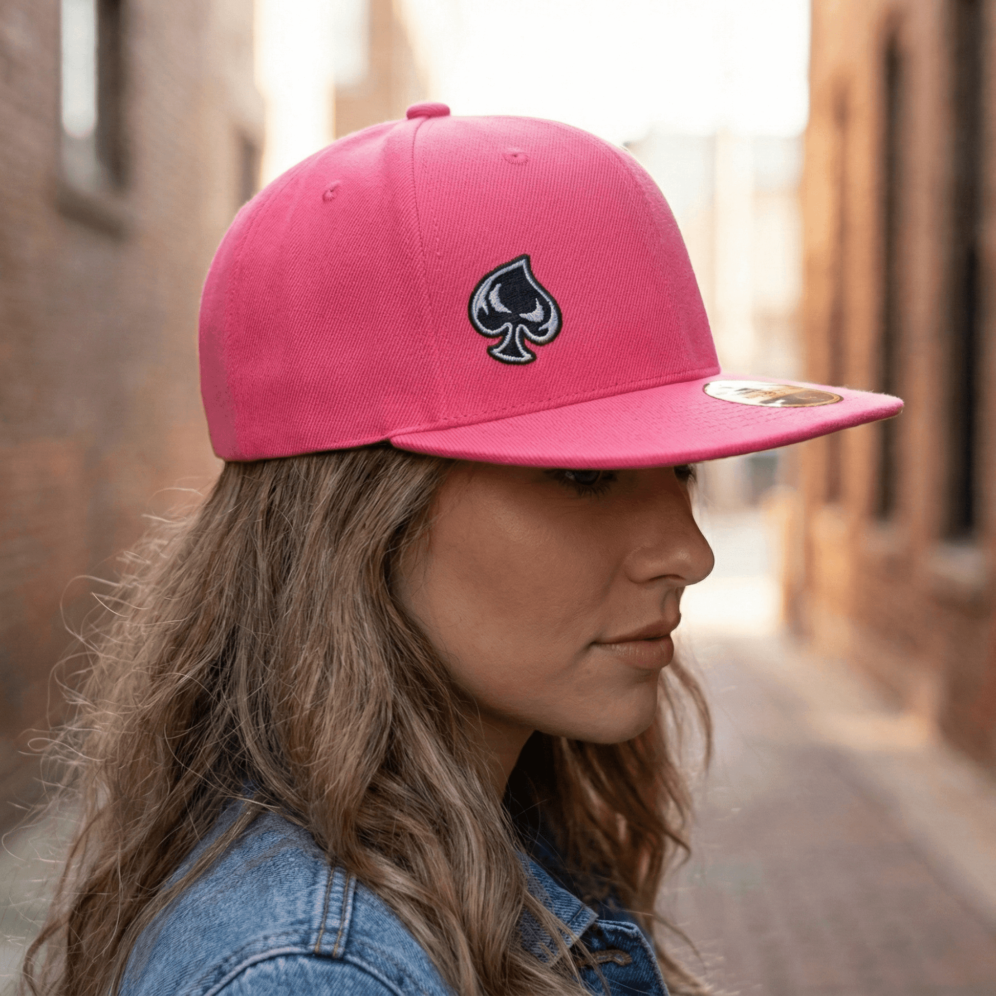Ai generated picture of a woman wearing a pink hat with a spade logo